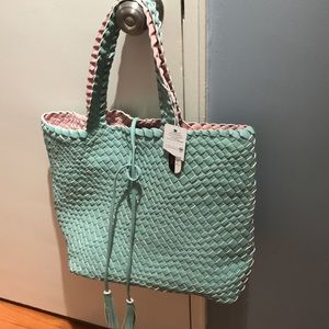 Large tote; reversible, removable liner.